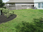 Easy Lawn Care of Houston, TX, will provide mulching service to yards like this.